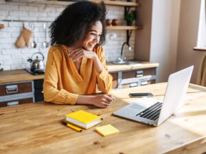 Female CHRO sits at her laptop